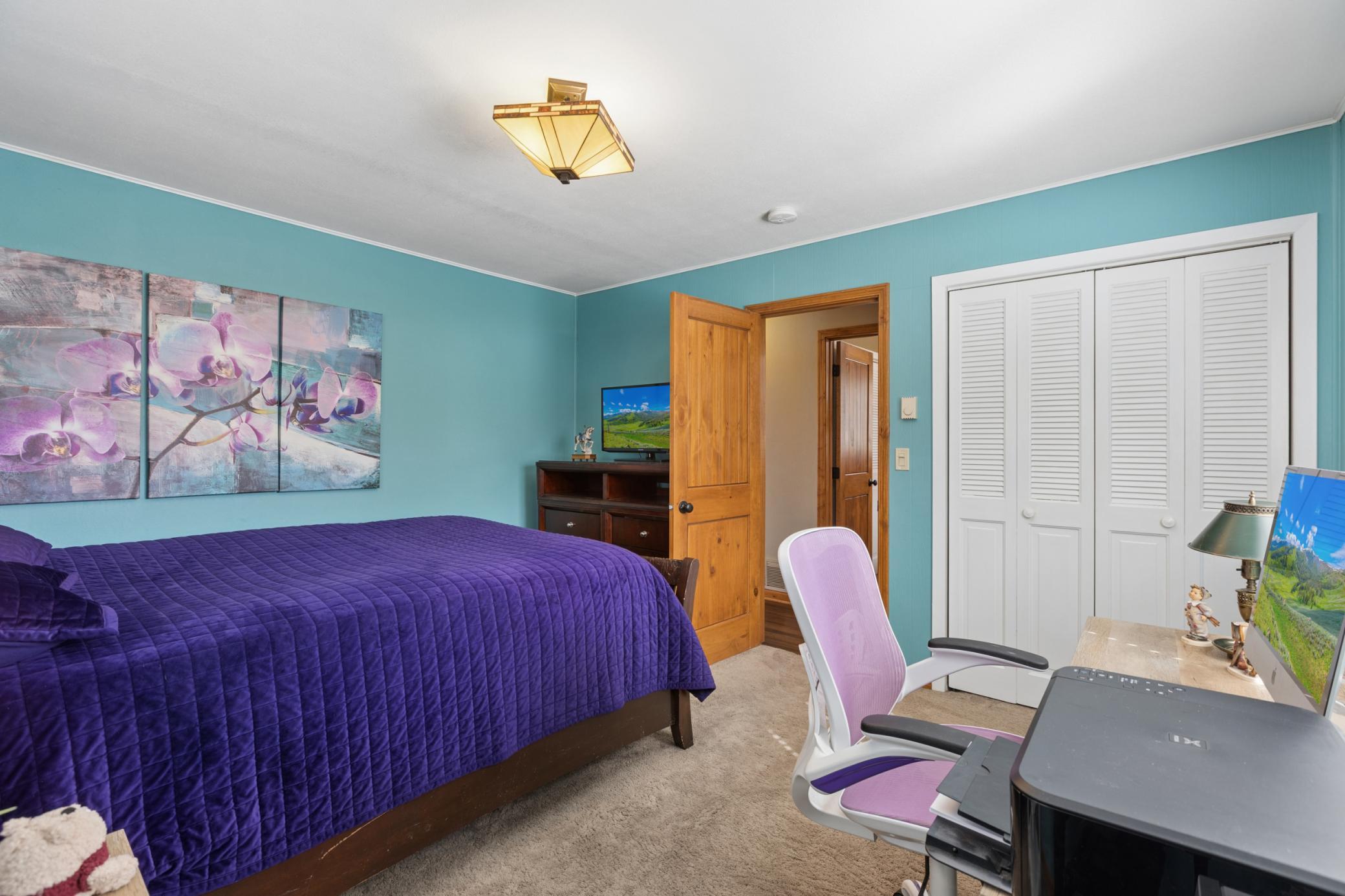 View of one of the two main floor bedrooms.