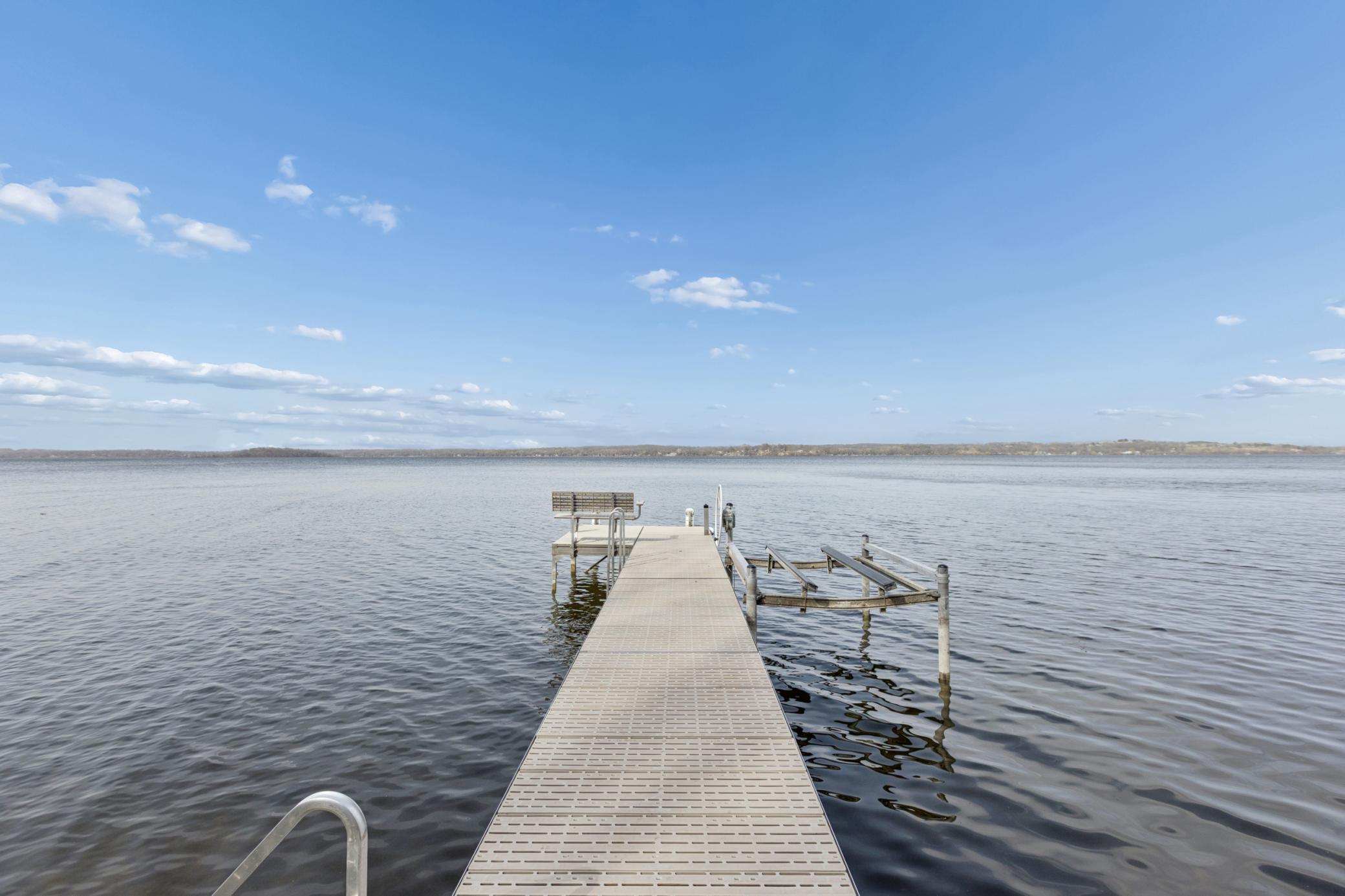 As you look out over Lake Koronis's expansive 2,968 acres you will see the first of three islands off to the left. The dock and jet ski lift can be for sale.