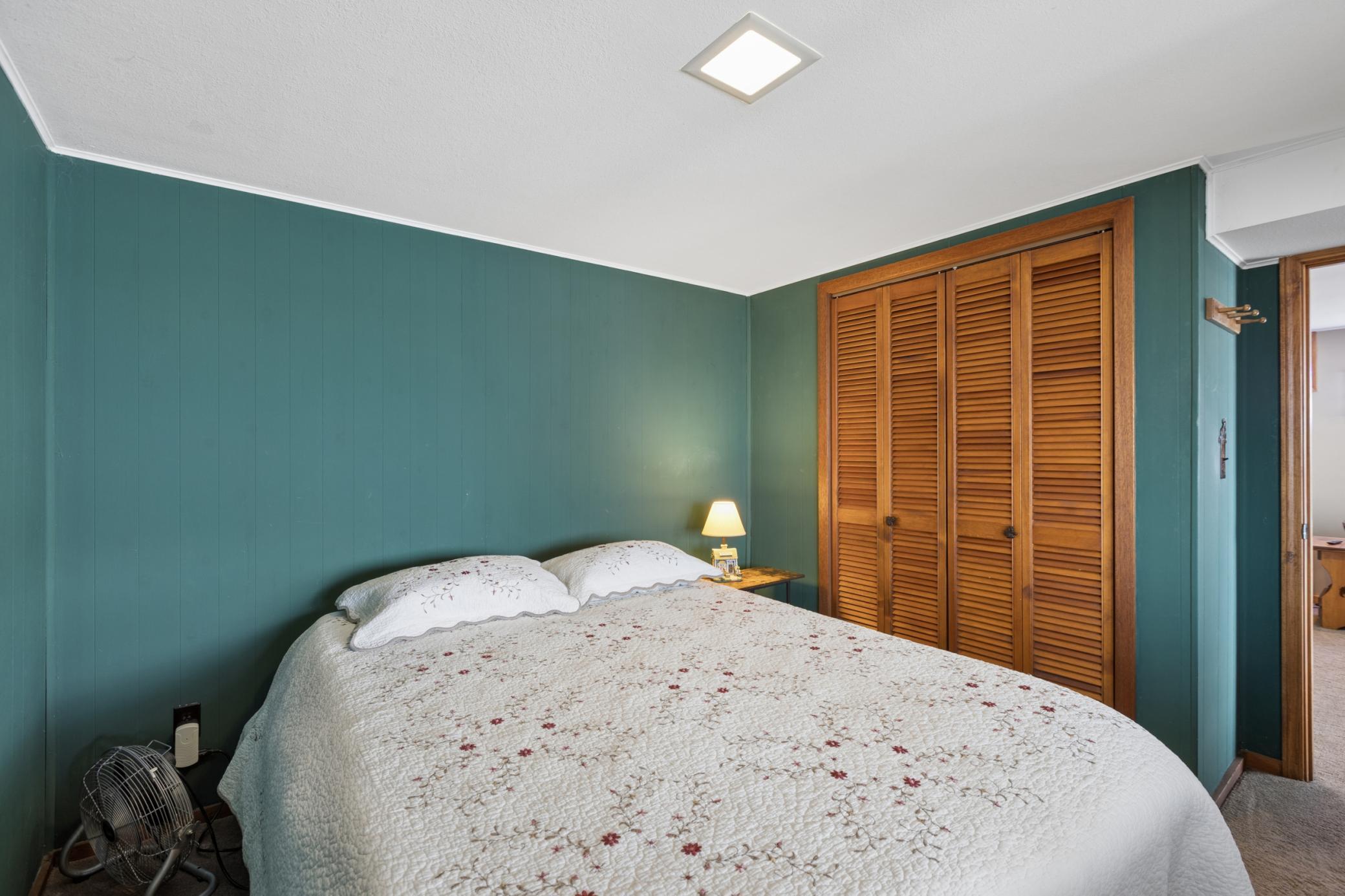 View of one of two lower level bedrooms both with nice sized closets.
