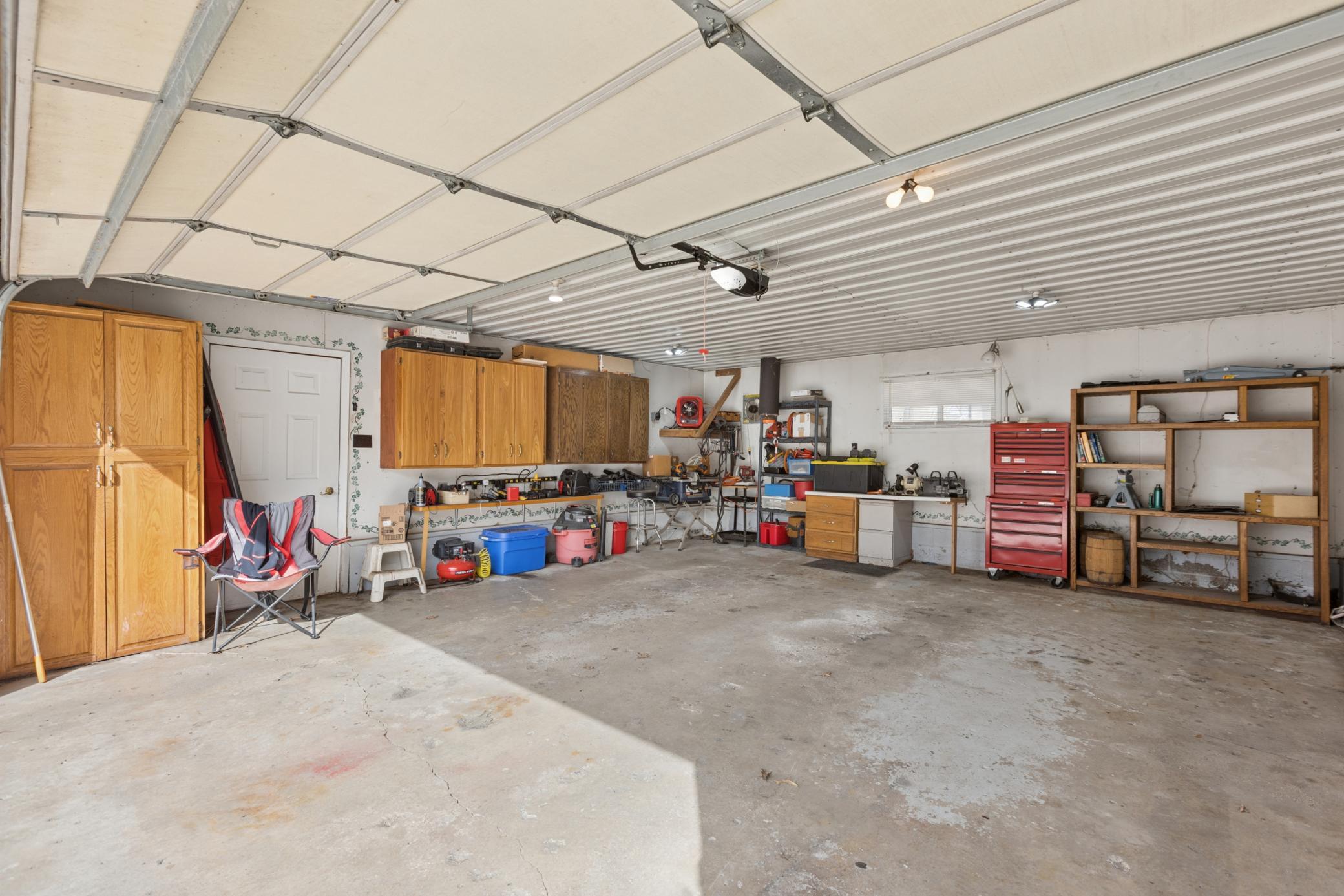 View of the two stall heated and insulated garage. In addition to this two stall garage is a single stall garage that is just cold storage.