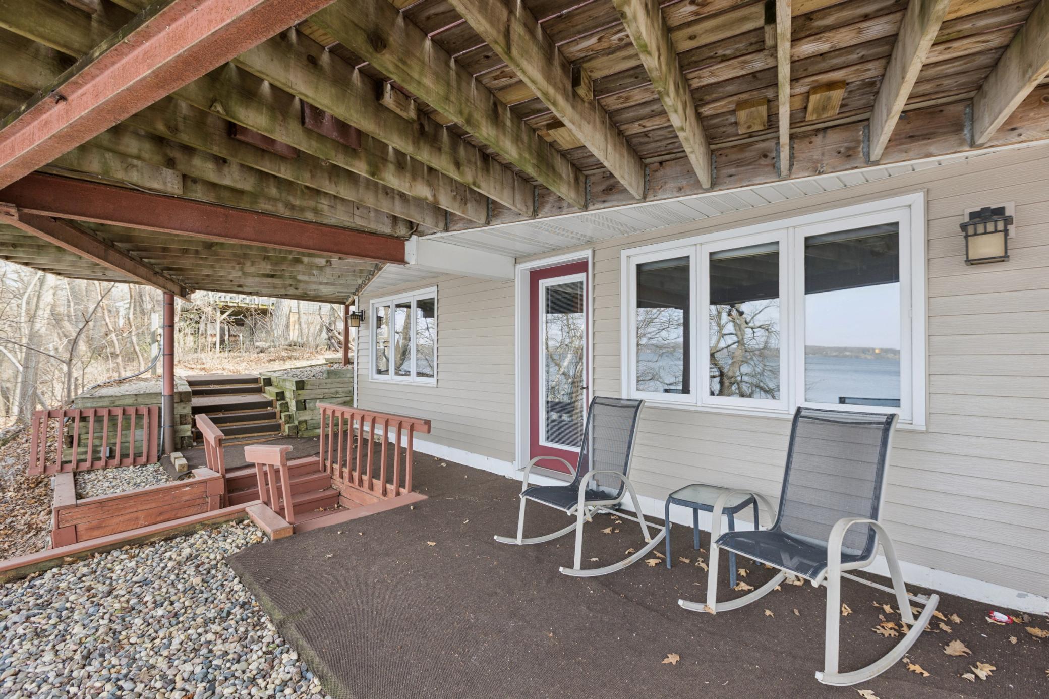 Just off the walk-out lower level is a patio underneath the deck. This property has so many great areas to take in the beauty of Lake Koronis. Directly across the street from this home is the 16.5-mile paved Lake Koronis Recreational Trail.