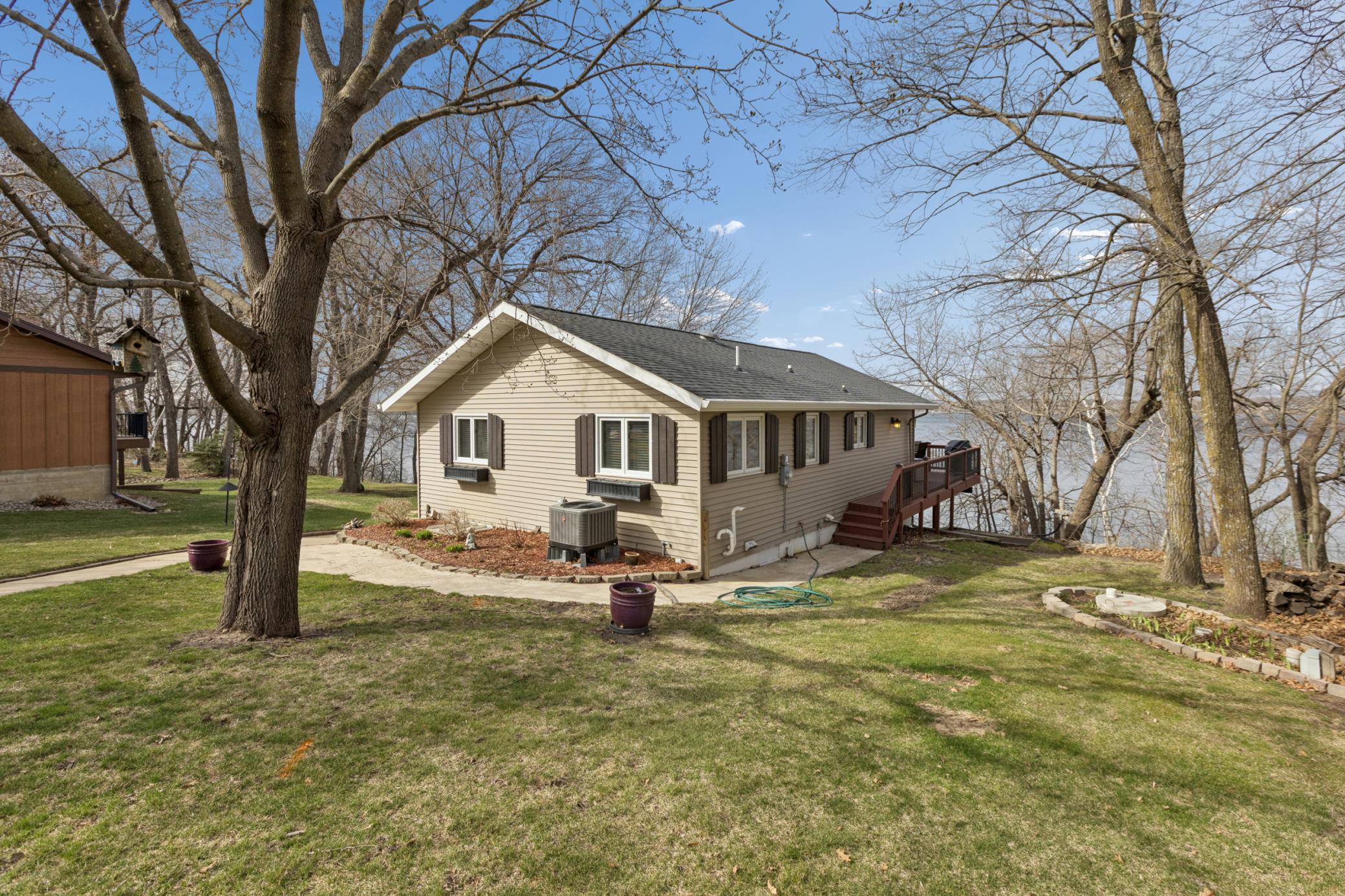 The lakeside deck wraps around both sides of the home with paths leading down to the lake. The septic compliance has already been completed for the full drainfield, so this property is ready for you to start enjoying! Roof on the home is one year old