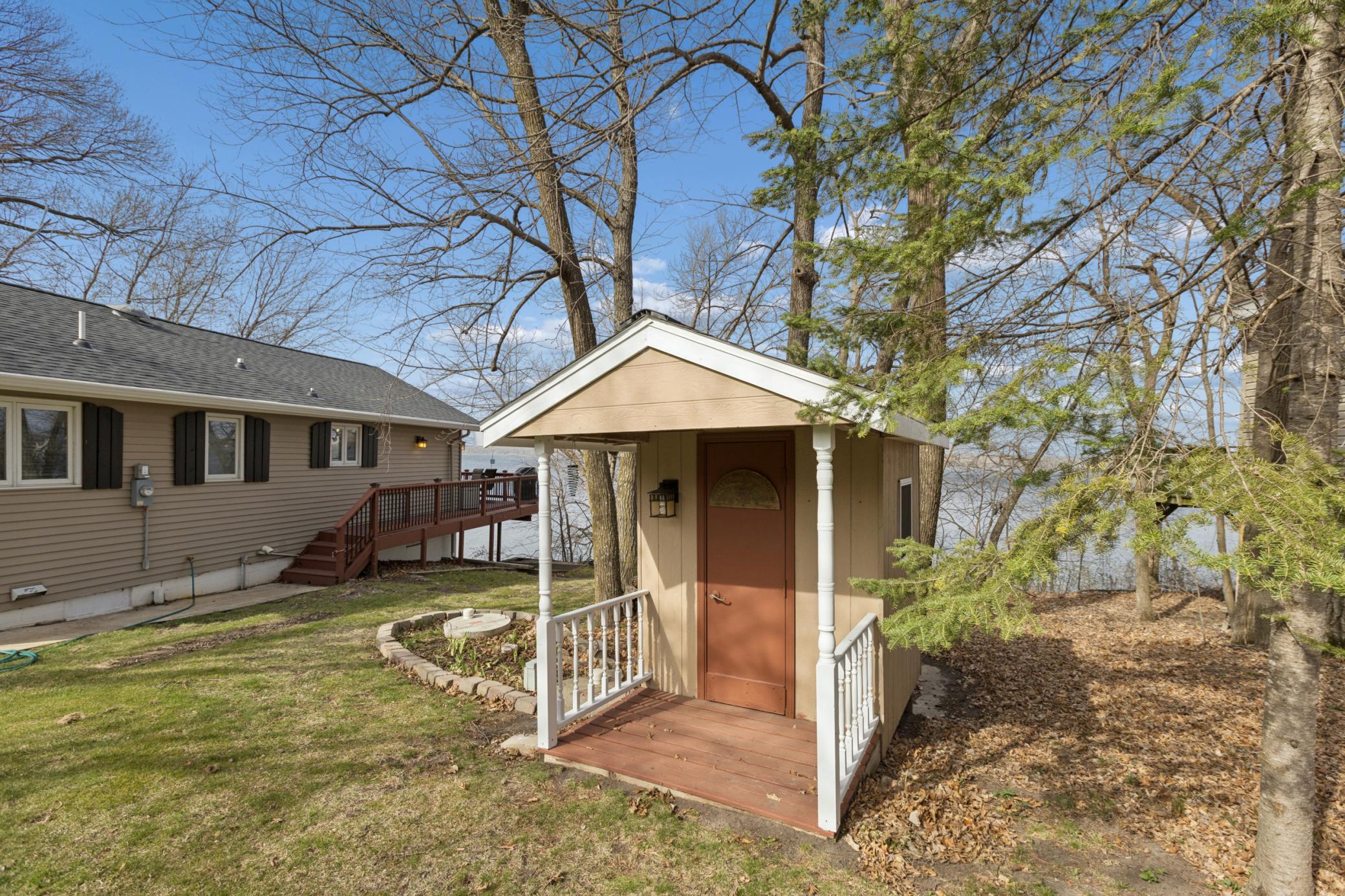 Off to the side of the yard is a garden shed for all of your yard tools. The property also has an in-ground sprinkler system that pulls water from the lake for irrigation.