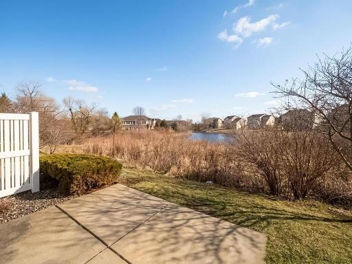 View of gorgeous pond and green space from your private patio