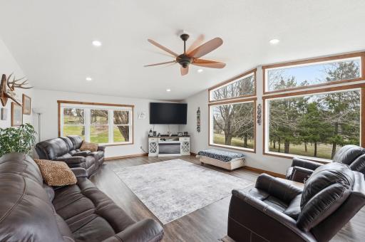 Main level living room area! Walls of windows offers great views!
