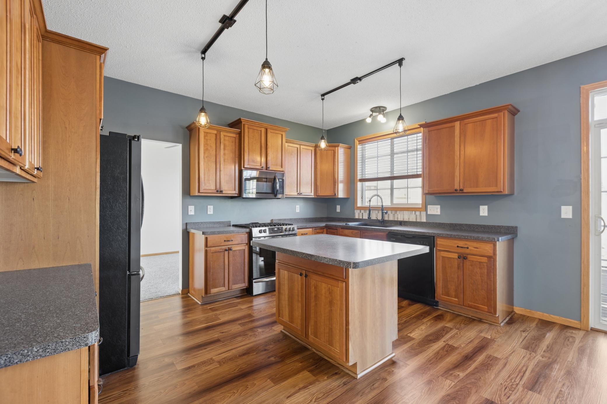 Gorgeous Kitchen with Center Island and Stainless Steel Appliances