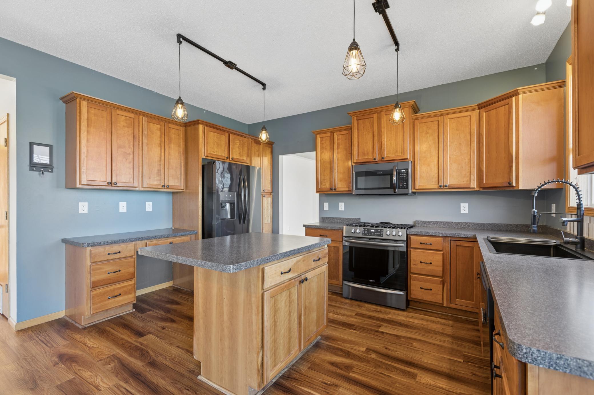 Gorgeous Kitchen with Center Island and Stainless Steel Appliances