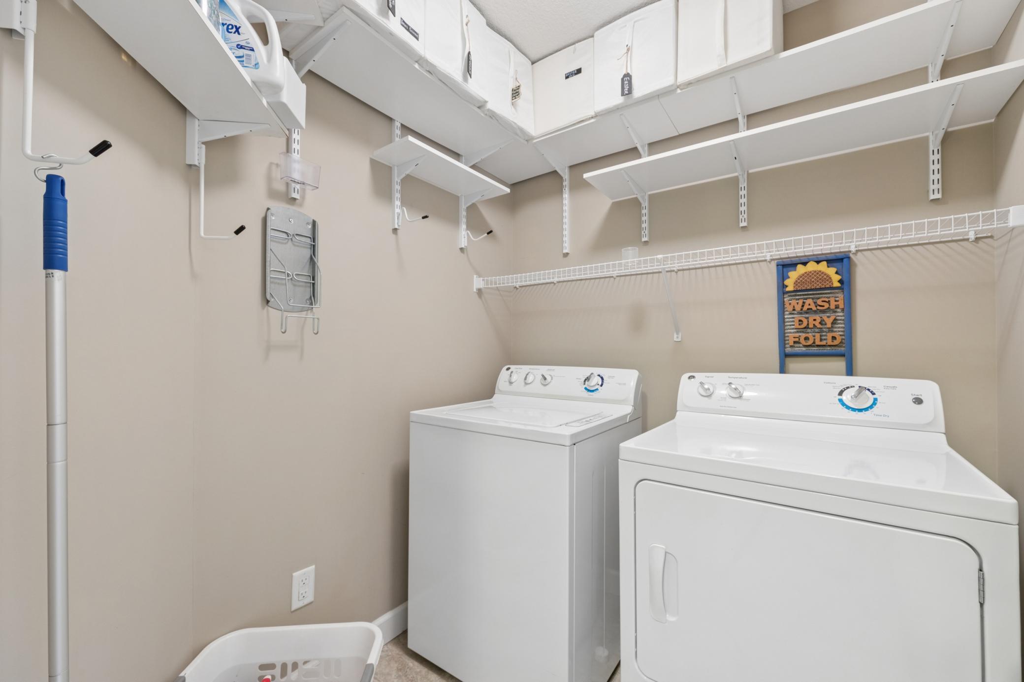 Upper level laundry with plenty of storage