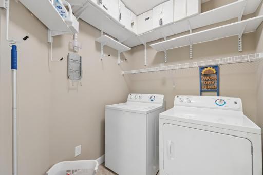 Upper level laundry with plenty of storage