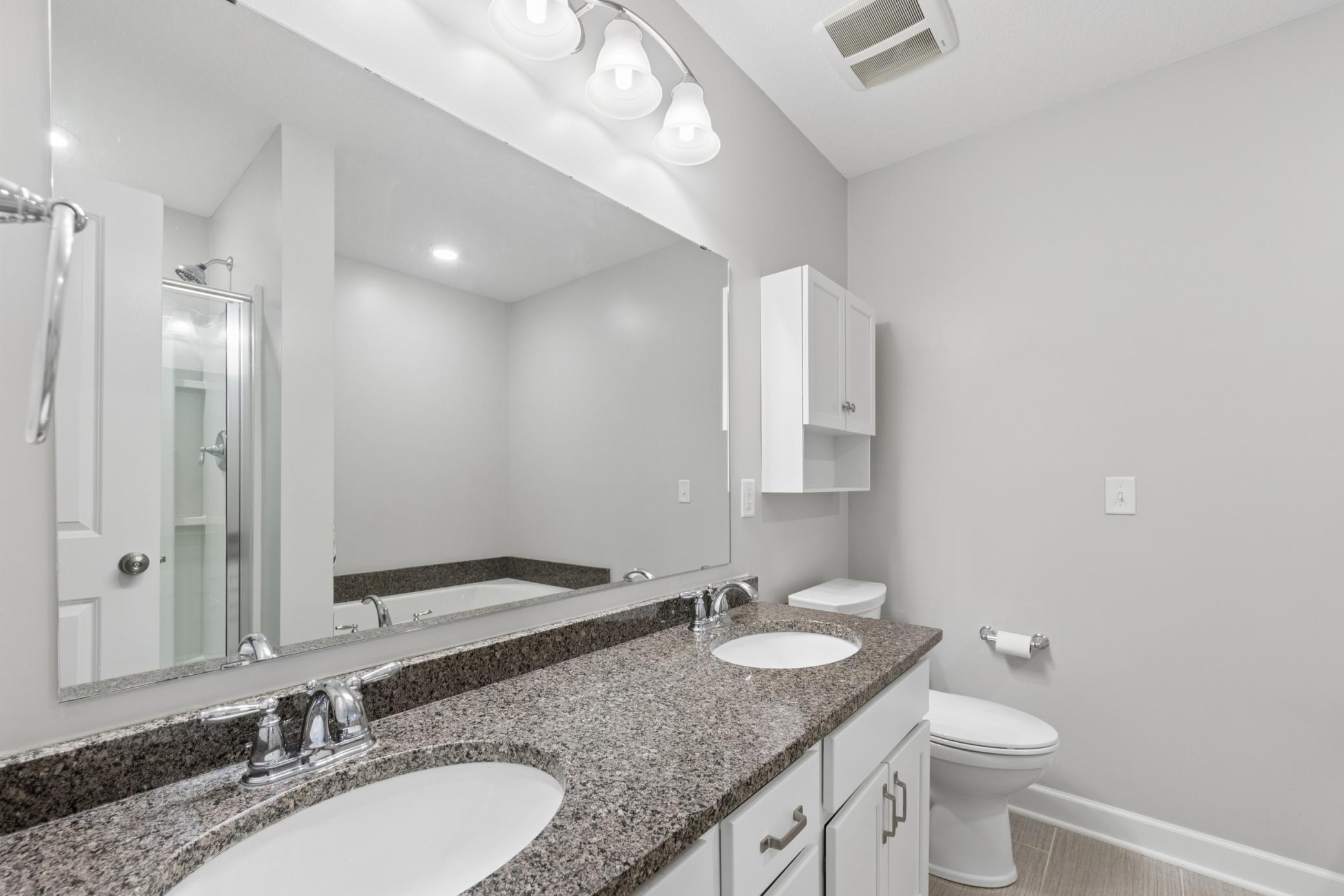 Private primary bath with dual vanities