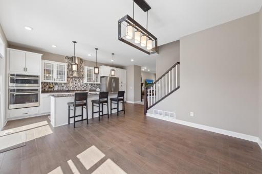 View back towards kitchen with lovely granite counters and huge center island