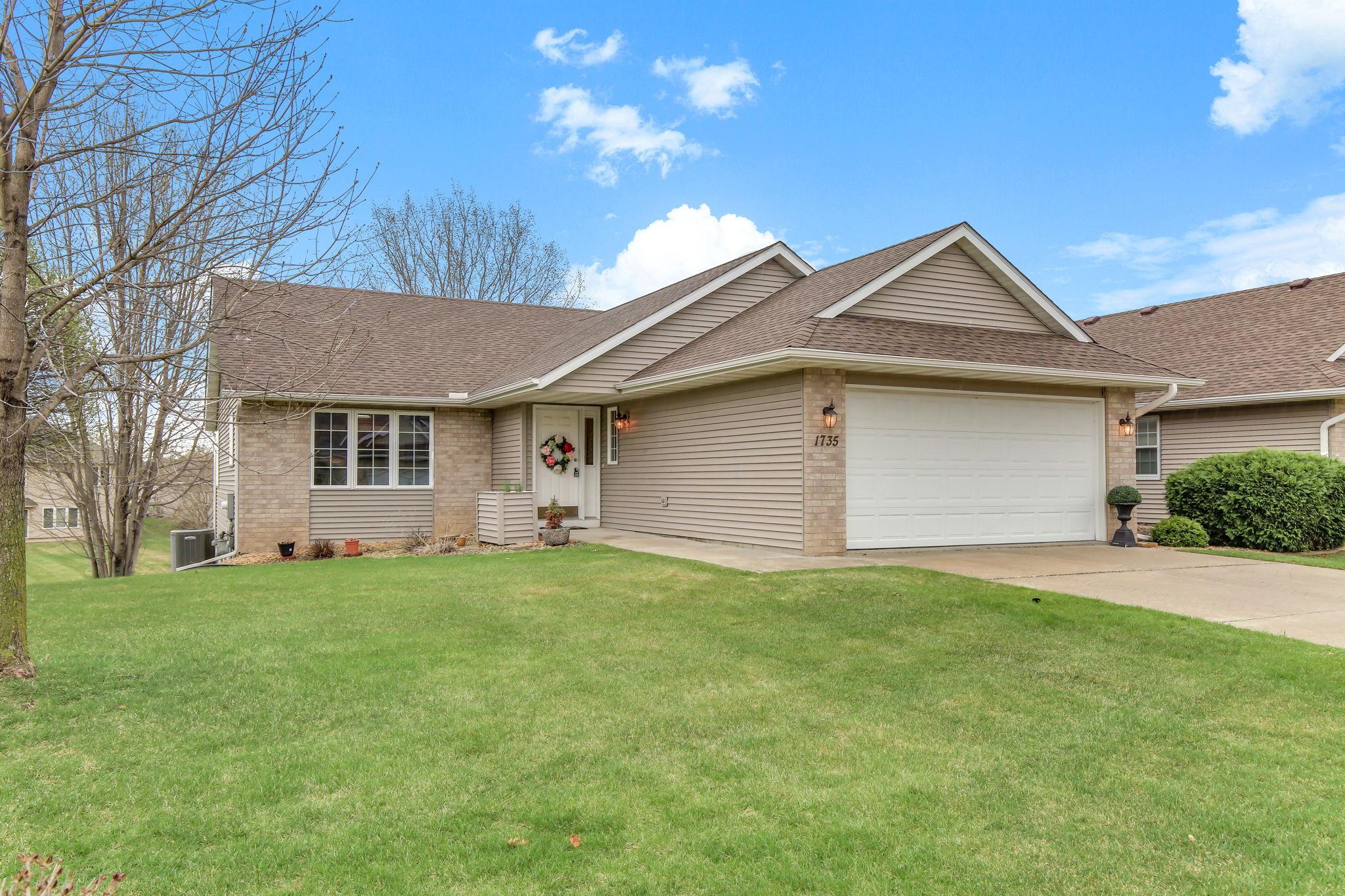 Well-kept one-level townhome with great curb appeal and a desirable Carleton Drive location.