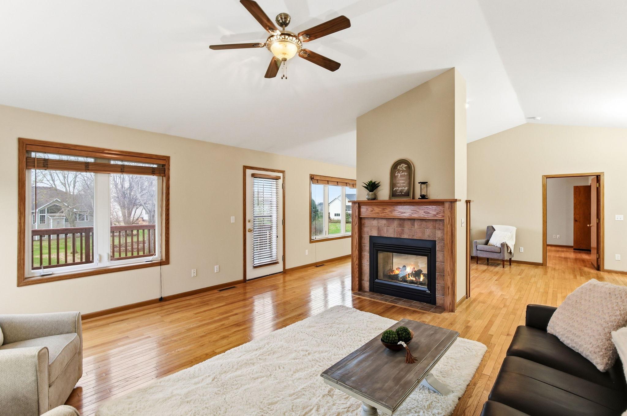 Gas see-through fireplace serves as a focal point between the great room and living room, with flexible space for a second sitting area or office.