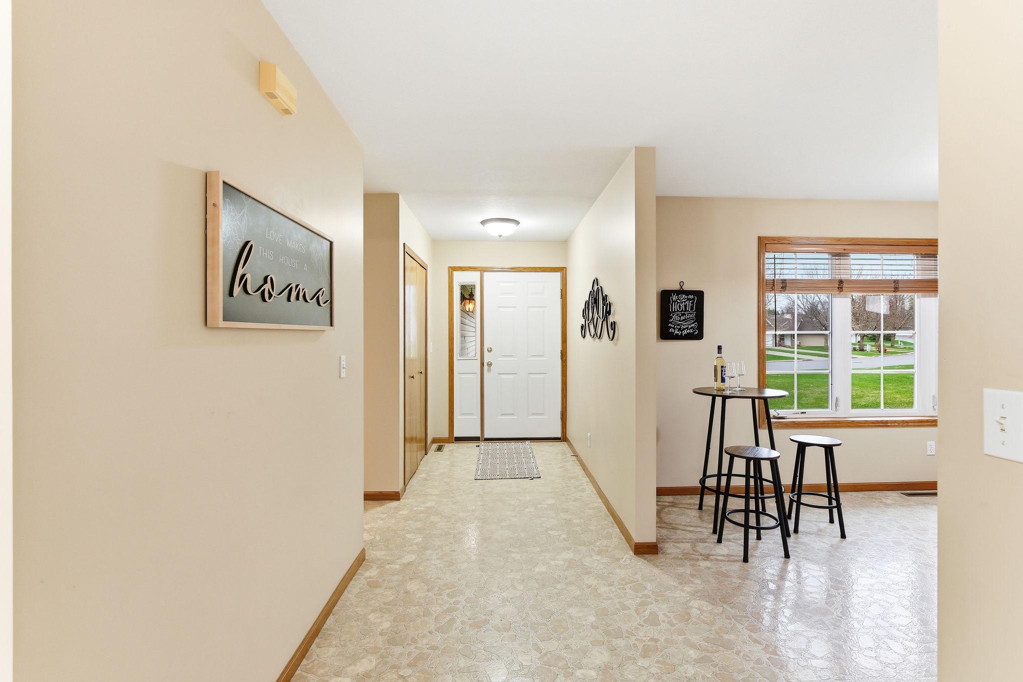 Large Foyer off the Front Door & Garage Door.