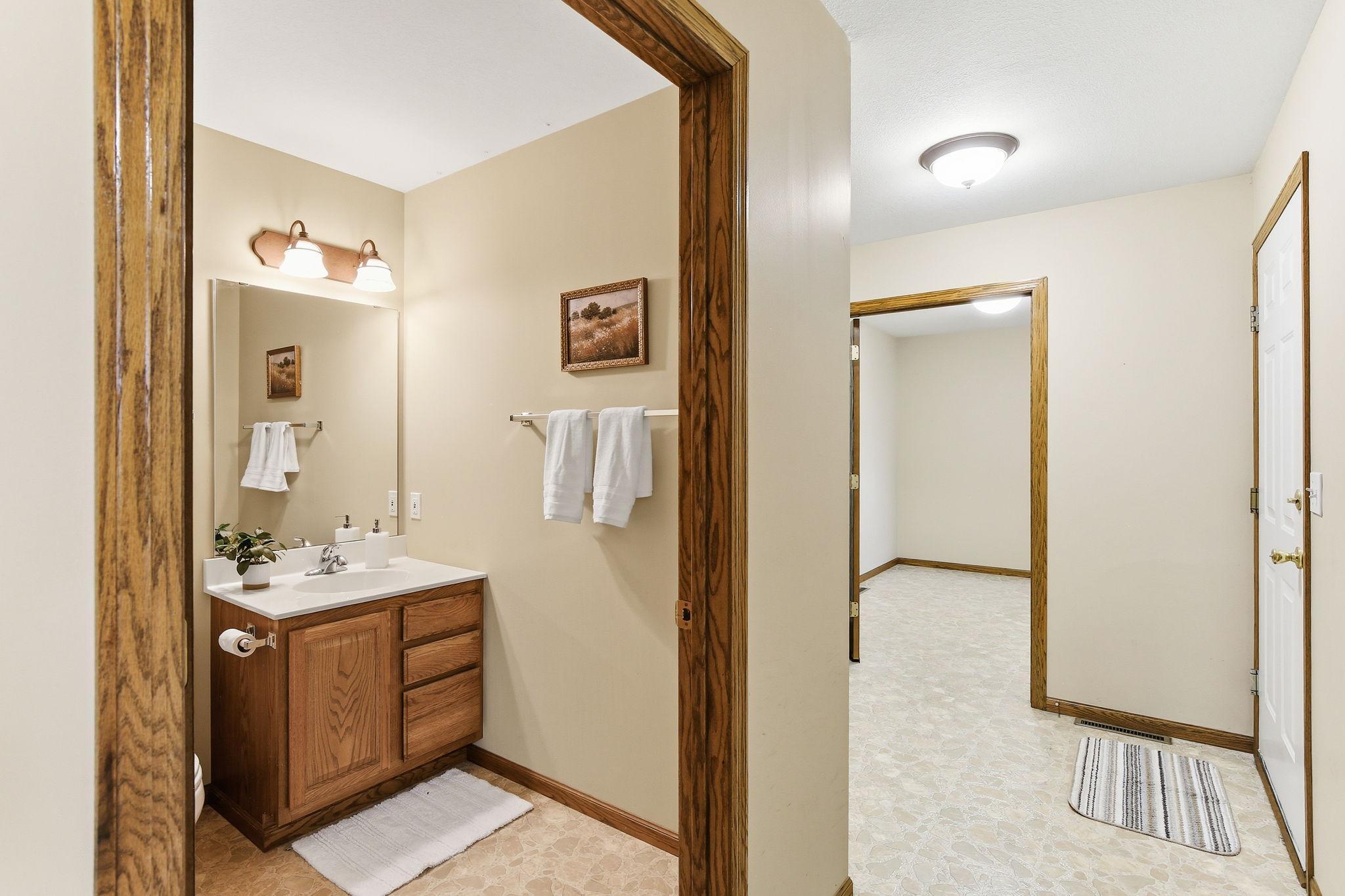 Convenient half bath located just off the entry and garage area.