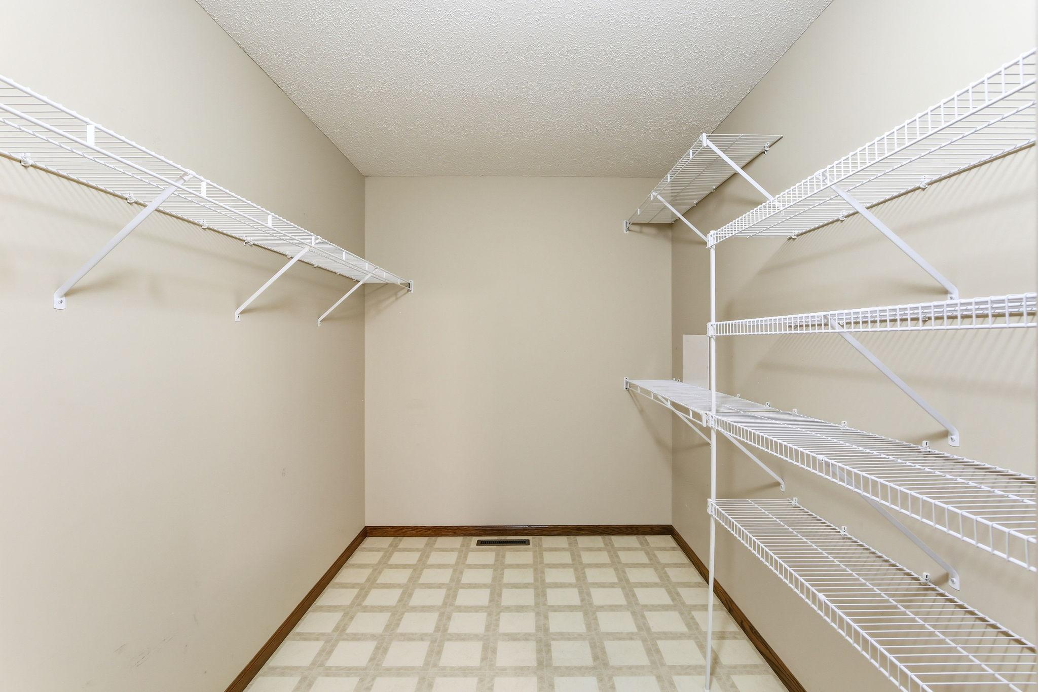 Large walk-in closet offering plenty of storage and organization space.