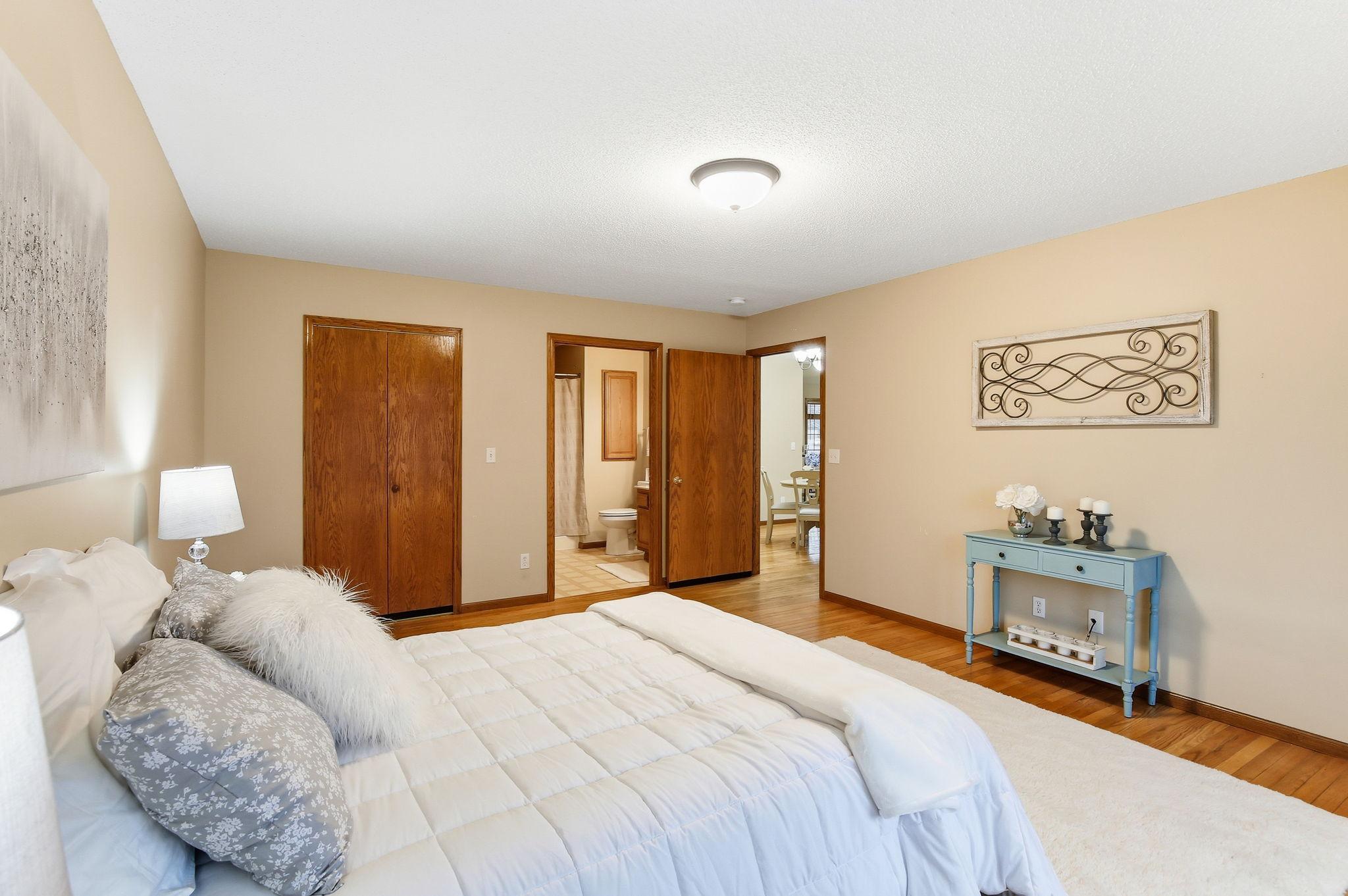 Generous primary suite with easy access to the private bath and walk-in closet.