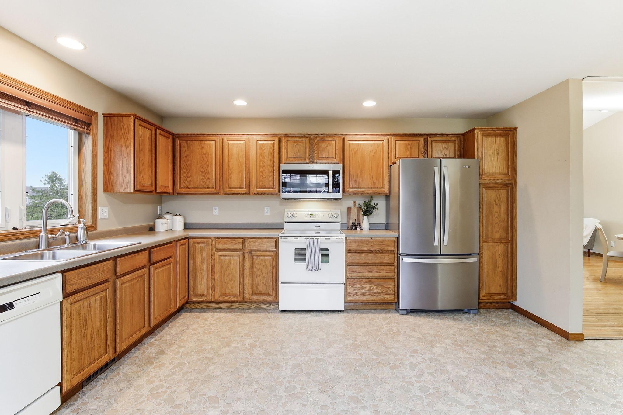 Abundance of cabinetry and workspace with a layout that flows well into the main living areas.