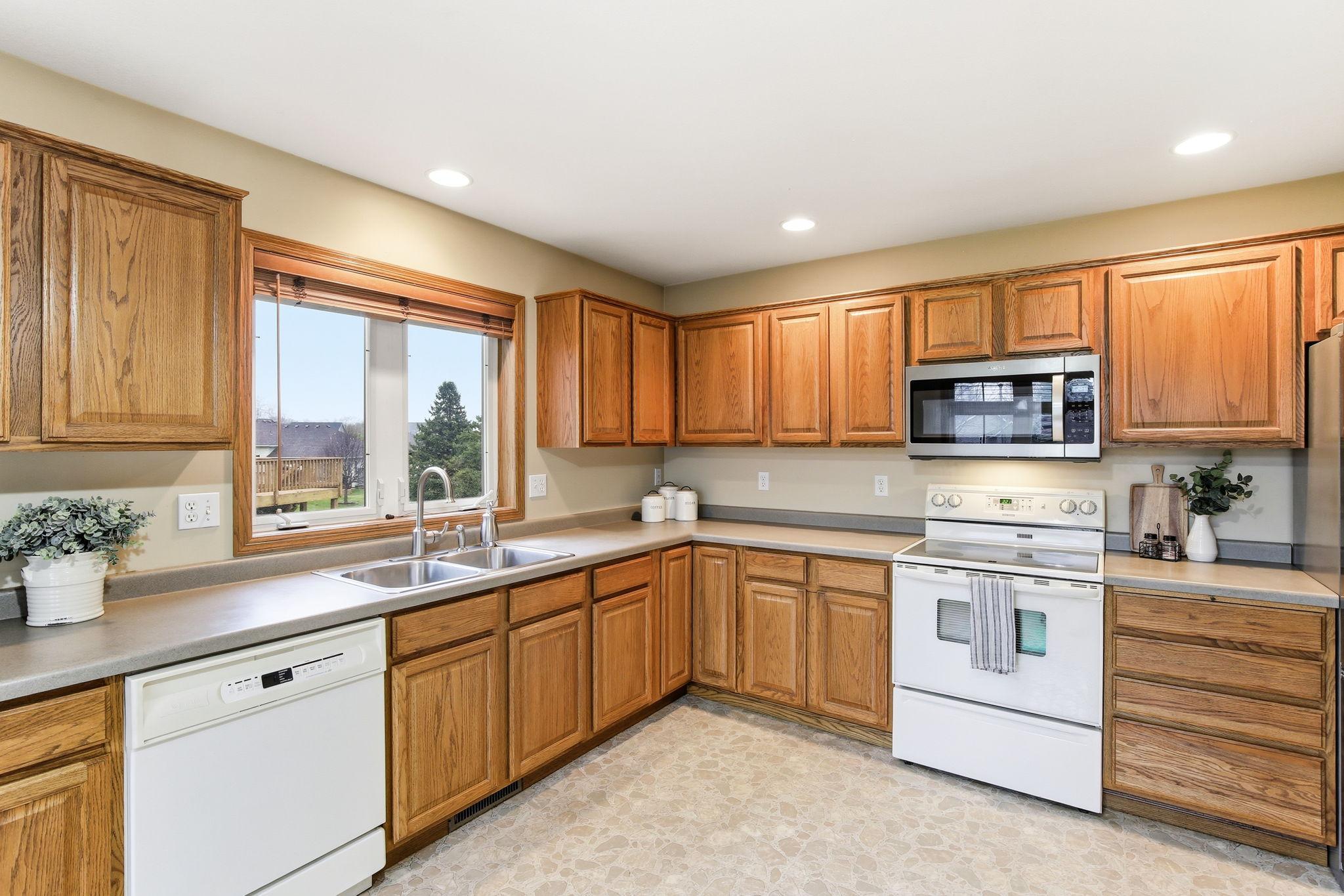 Functional kitchen layout with plenty of counter space and a window over the sink for natural light.