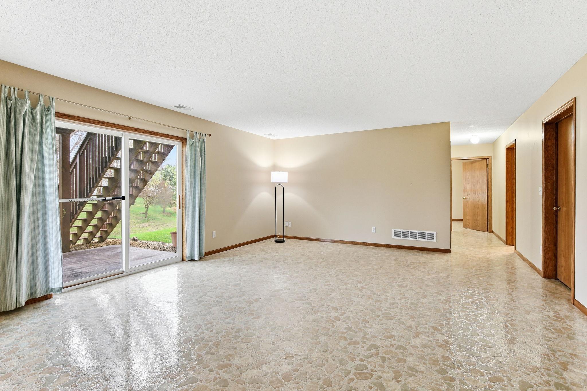 Large lower level family room with walkout access to the patio and backyard.