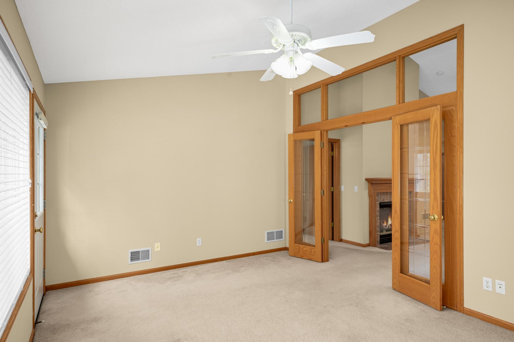 Glass-front French doors in the sunroom add charm and allow light to flow throughout