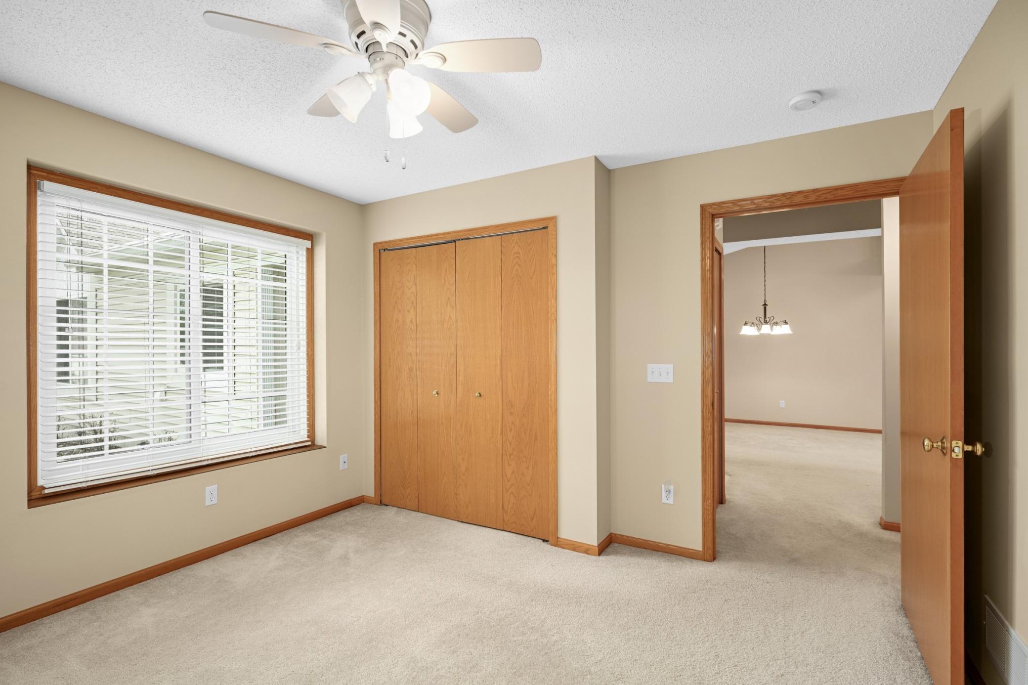 Guest bedroom features a large closet with plenty of storage space