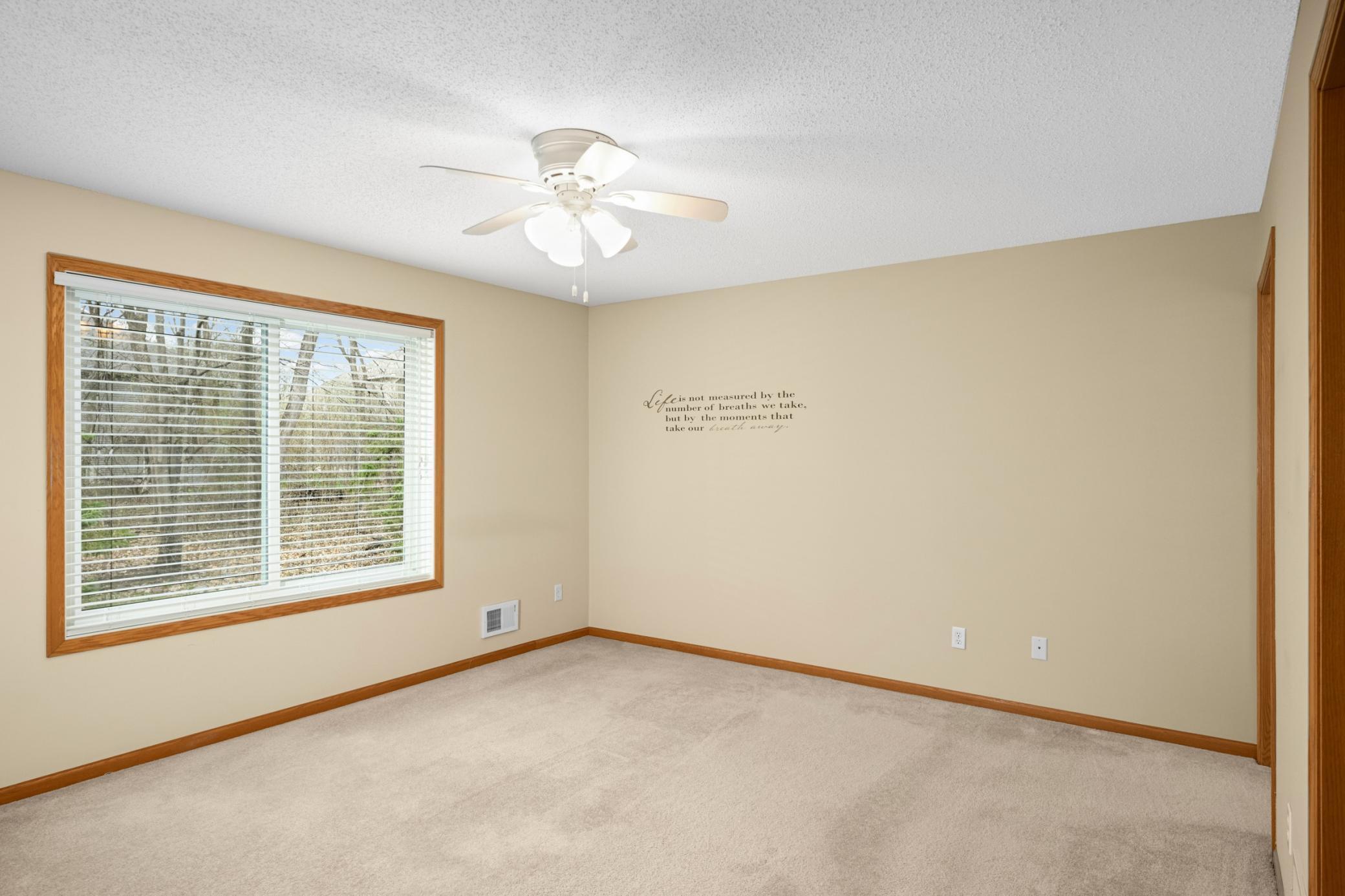 Expansive primary bedroom with plenty of space for comfort and relaxation