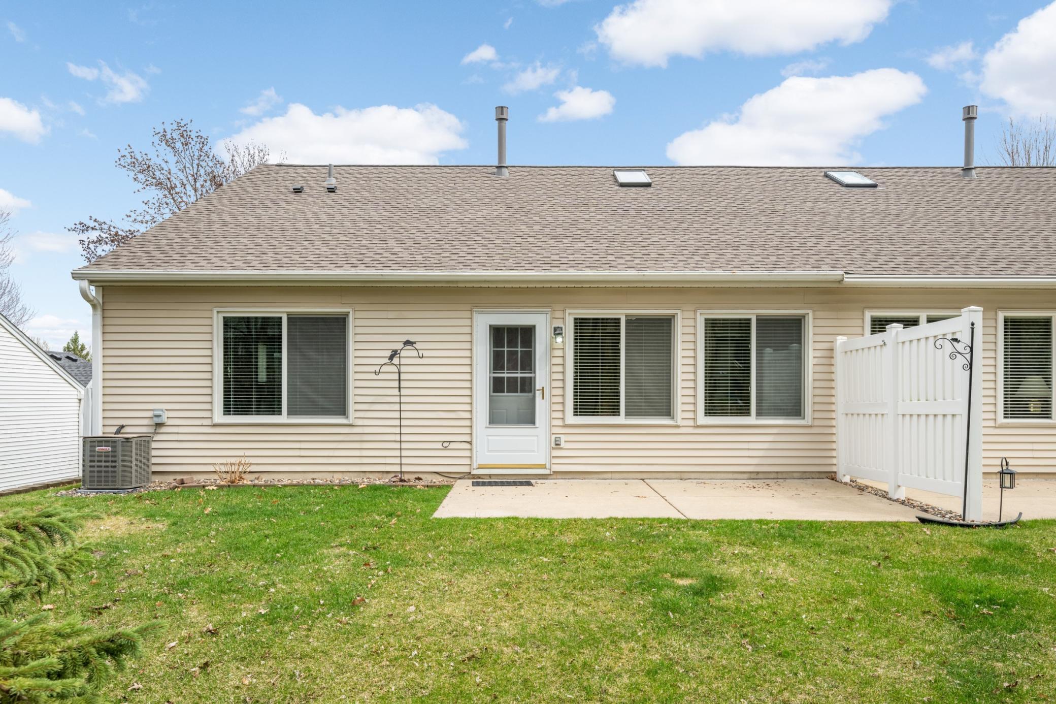 Private concrete patio with easy access from the sunroom, perfect for indoor-outdoor living
