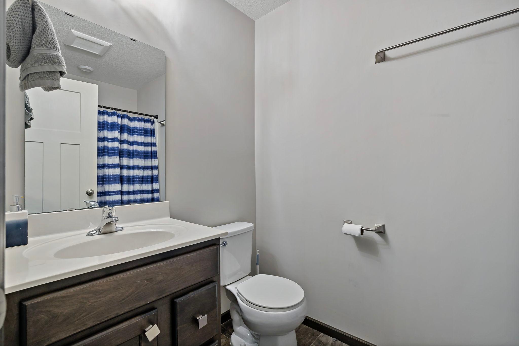 The upper-level full bath serves both bedrooms and features a practical layout designed for everyday convenience and comfortable use.