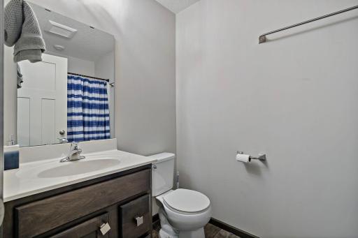 The upper-level full bath serves both bedrooms and features a practical layout designed for everyday convenience and comfortable use.