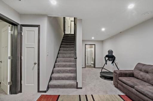 The lower level offers additional living space, including a comfortable family room, a bedroom, and a 3/4 bathroomâideal for guests or extended living needs.