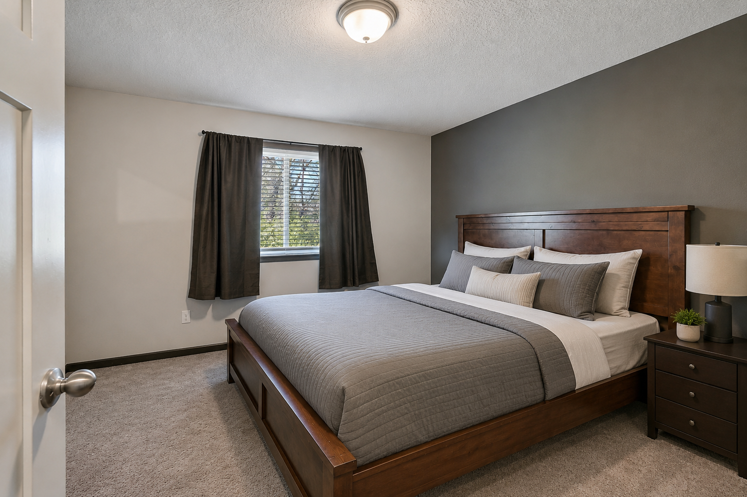 The primary suite offers a generous room and a comfortable layout, complete with direct access to a private bathroom and a walk-in closet for added convenience and storage.