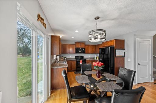 Connects seamlessly to the dining area with updated statement lighting (2026). From here, step directly out to the back patio, perfect for enjoying meals or relaxing outdoors.