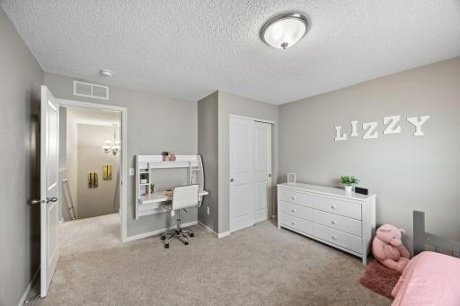 Two additional bedrooms located on upper level.