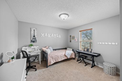 Offering plenty of natural light, comfortable carpeting, and closet storage.