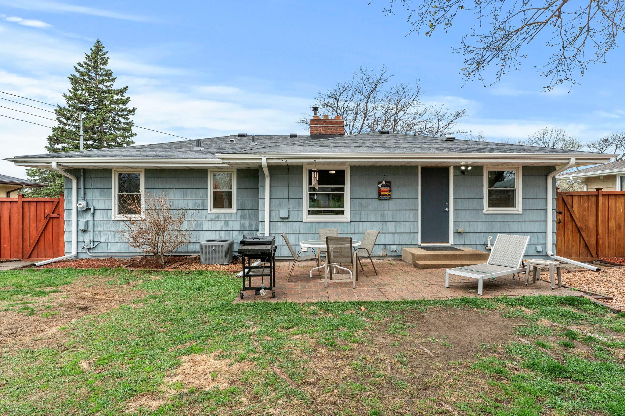 The rear exterior view of the home, featuring the inviting patio that’s perfect for relaxing or entertaining.
