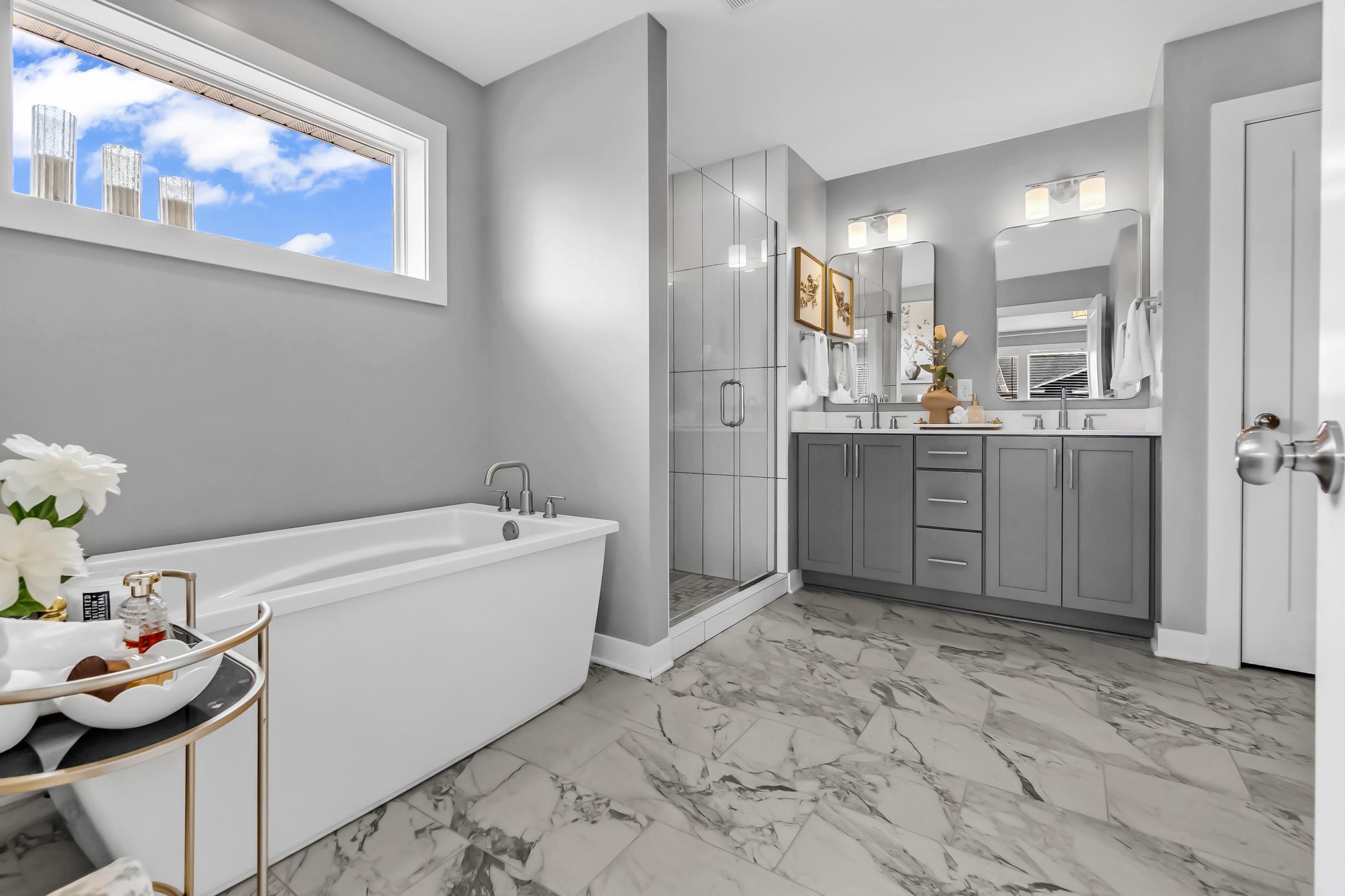 owners suite with soaking tub with separate shower.jpg