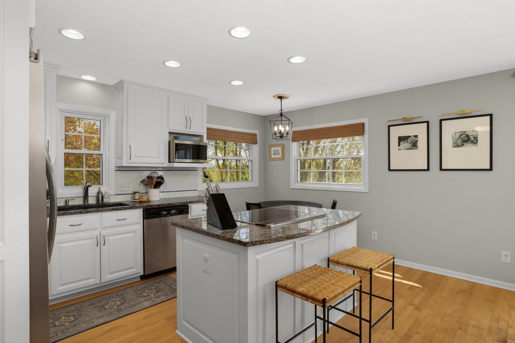 Another view of the kitchen featuring granite and stainless!