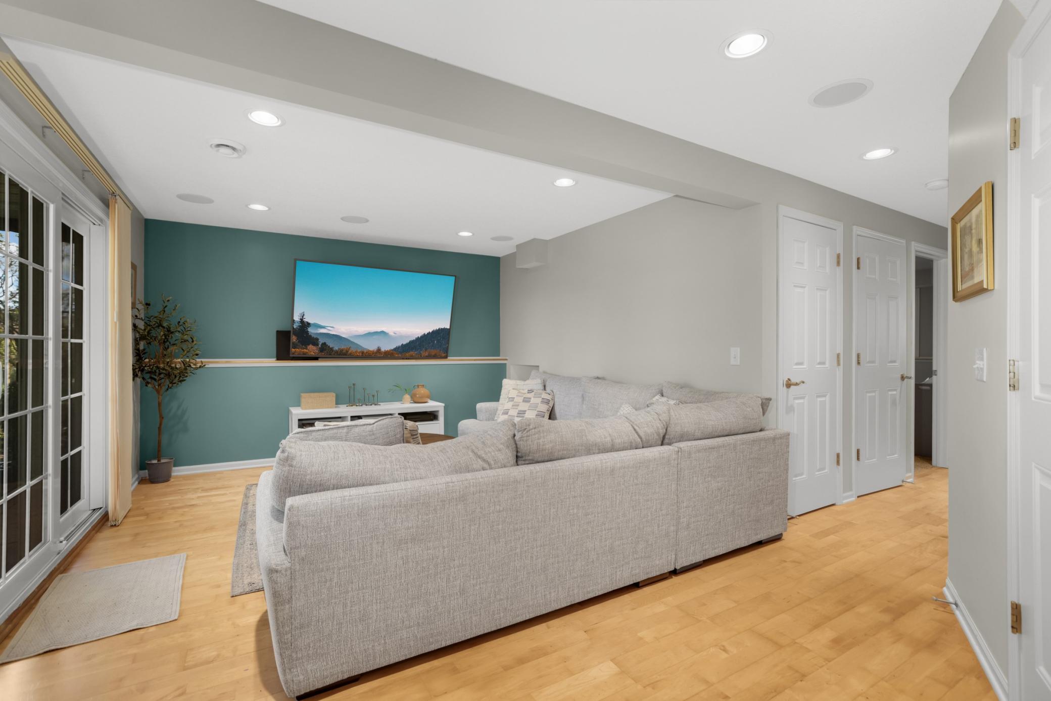 The lower level family room is wonderful for family movie night, MN sports and relaxing!