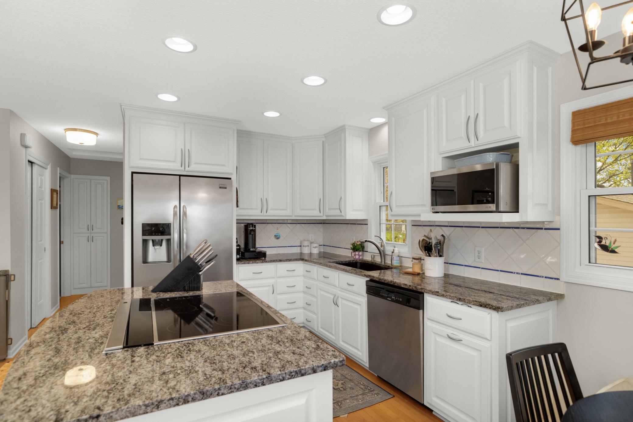 The cabinets to the ceiling are an amazing touch!