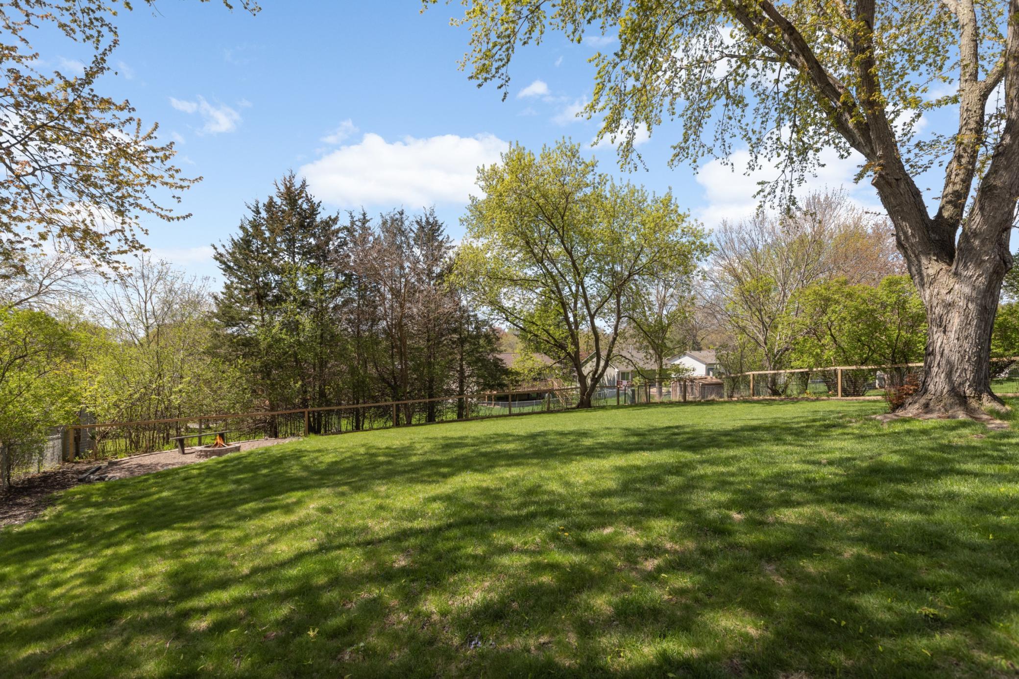 WOW! Its hard to find a private, tree lined backyard in the heart of Eden Prairie but here it is!