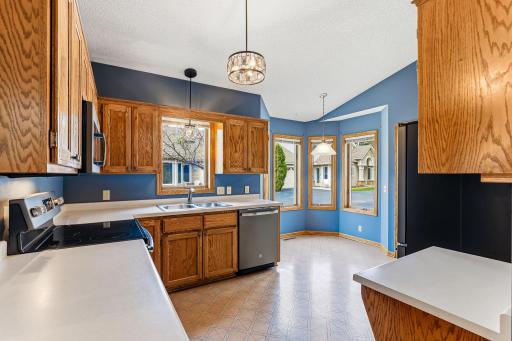 Kitchen features GE stainless steel appliances with slate finish!