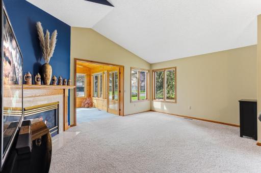 Spacious living room opens to the sun drenched 4-season porch!