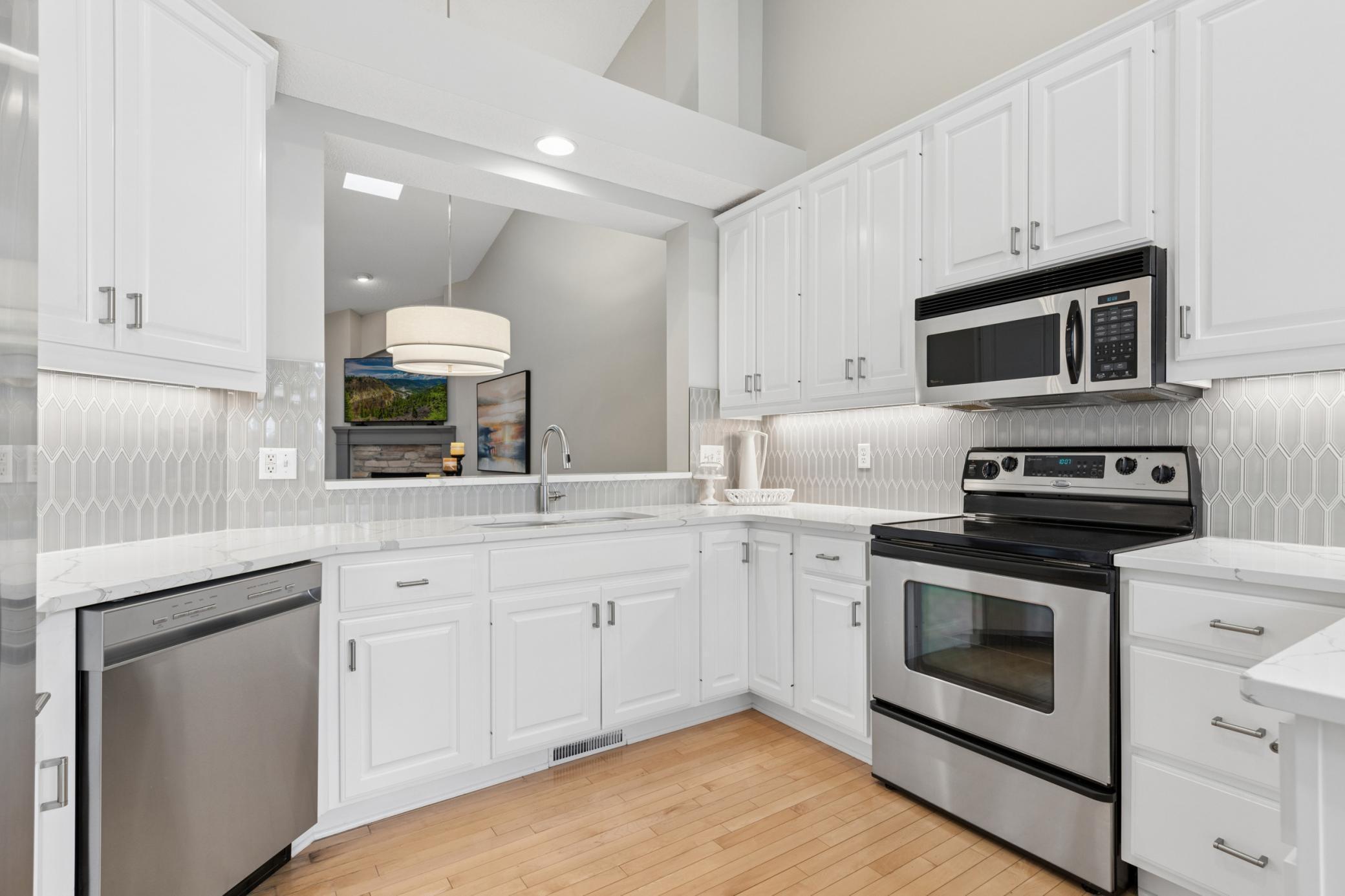 Bright and sunny kitchen with stainless appliances