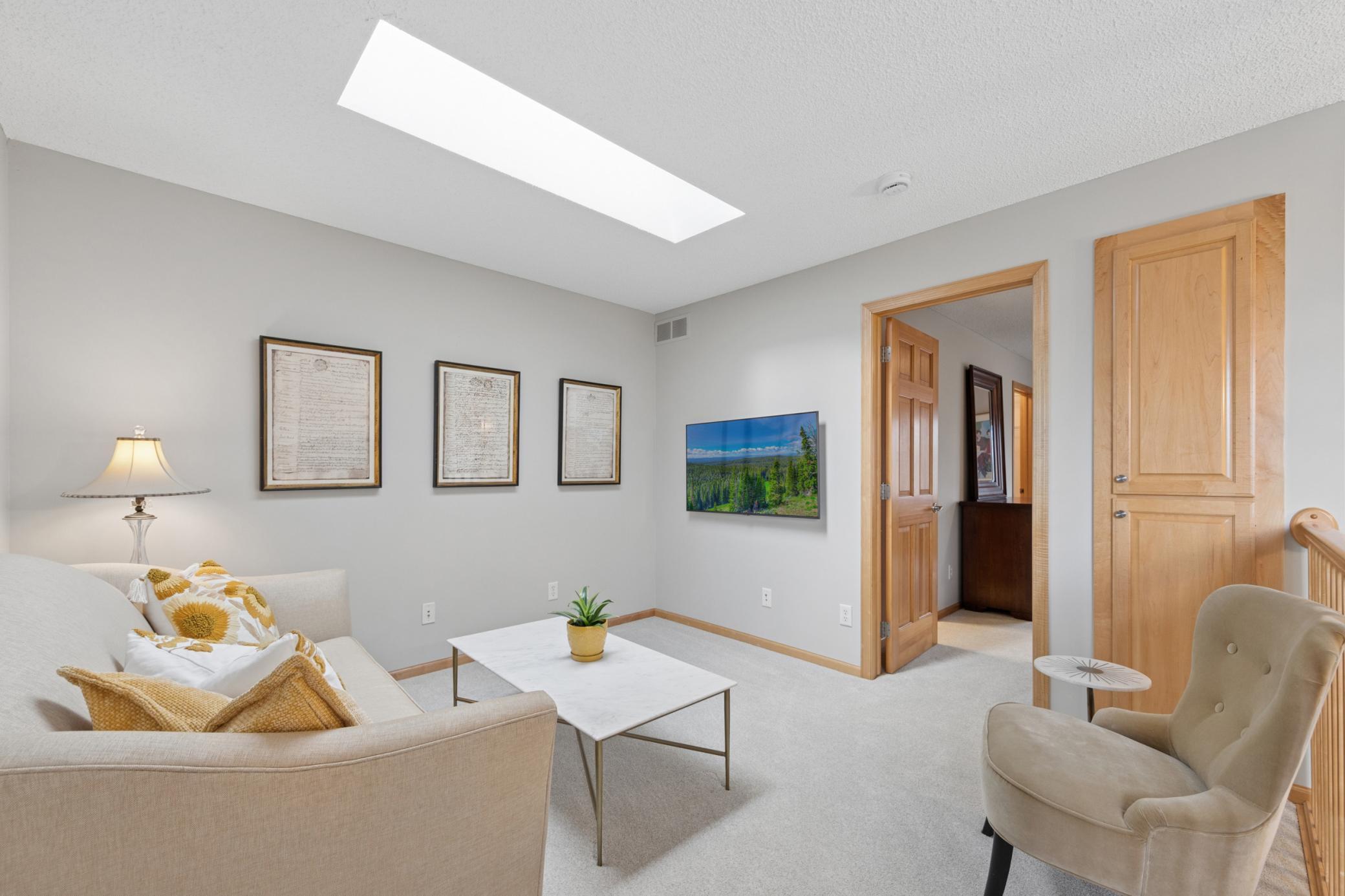 Lofted area with private bed, bath and sitting room