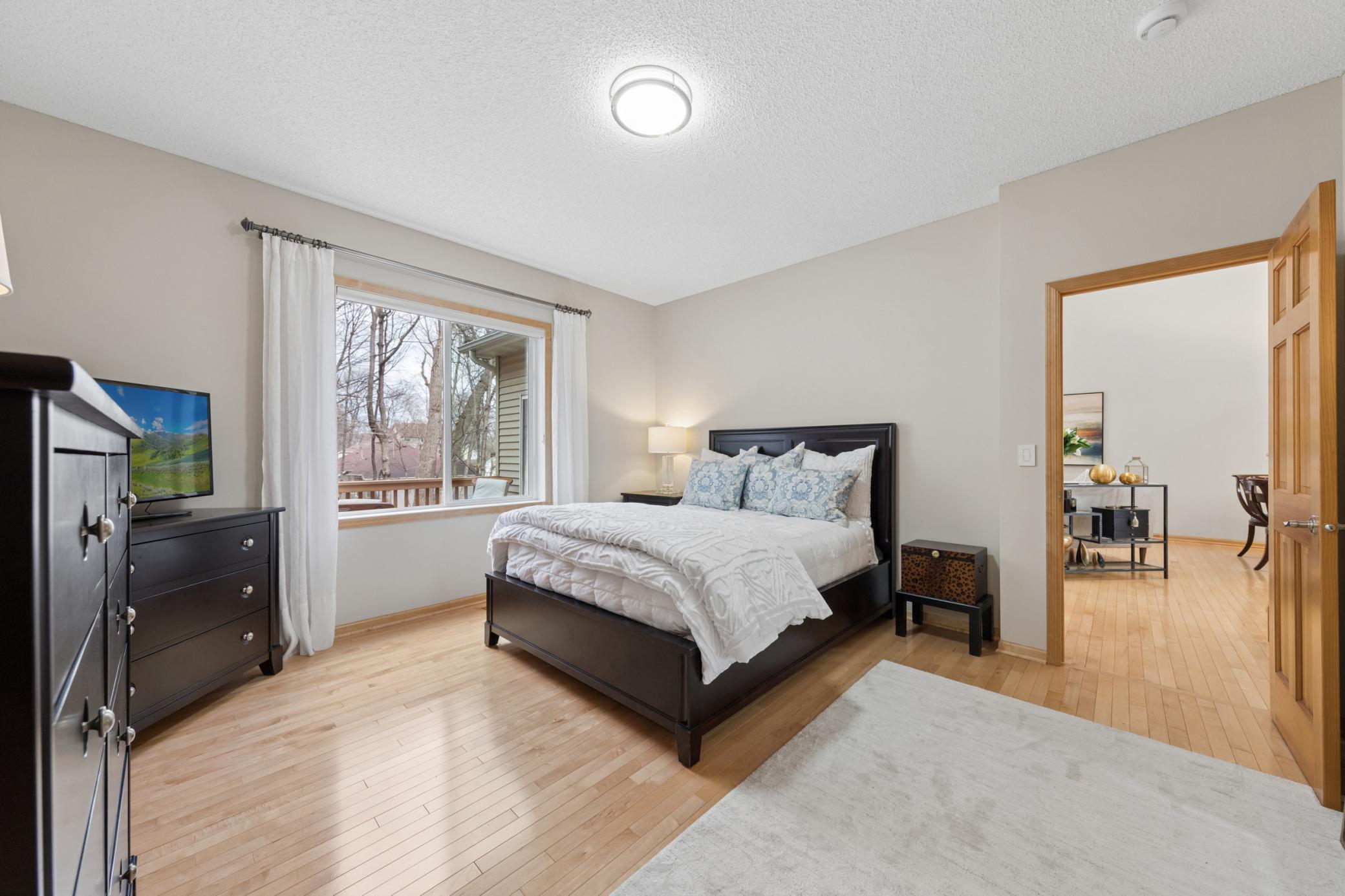 Main level primary suite with walk in closet and bath