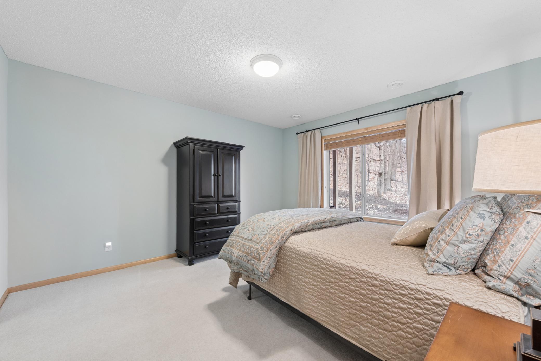 Lower level bedroom with private bath. Walk out affords plenty of natural light