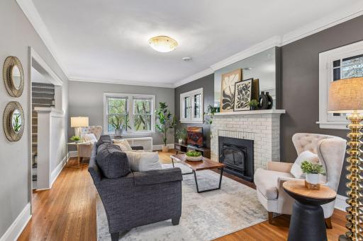 Warm interior with hardwood floors and a charming fireplace
