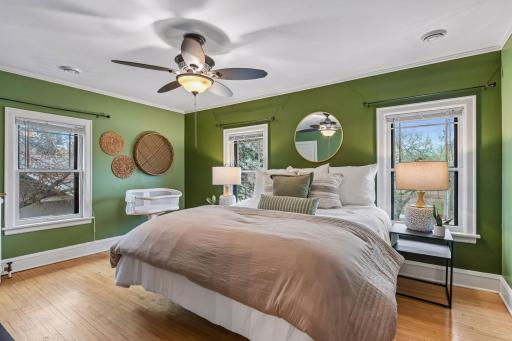 Inviting primary bedroom filled with natural light