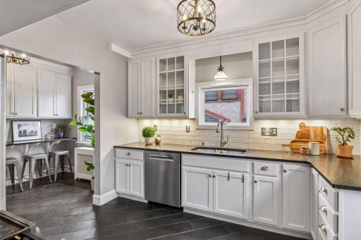 Stylish kitchen featuring stainless appliances and subway tile backsplash